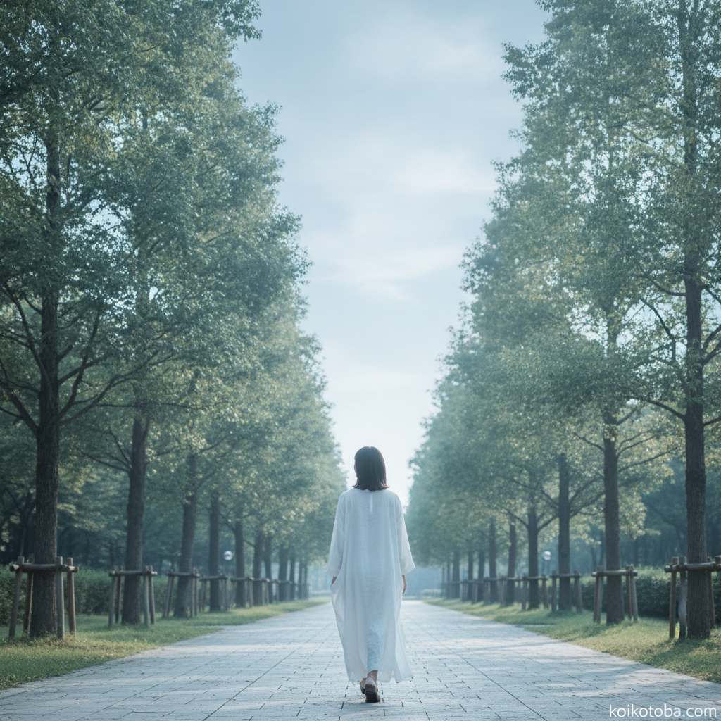 朝の並木道を一人静かに歩く人の後ろ姿